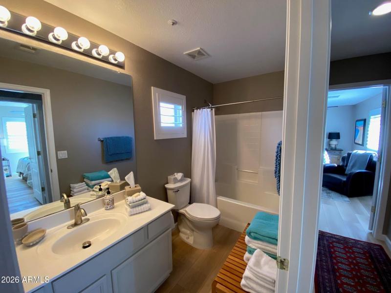 Hall bath with view of master entrance