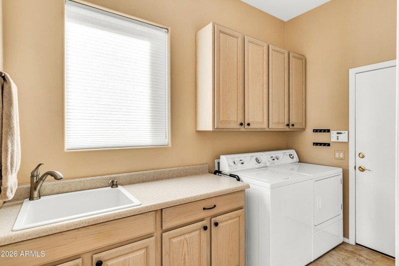 Laundry with Sink and Cabinets