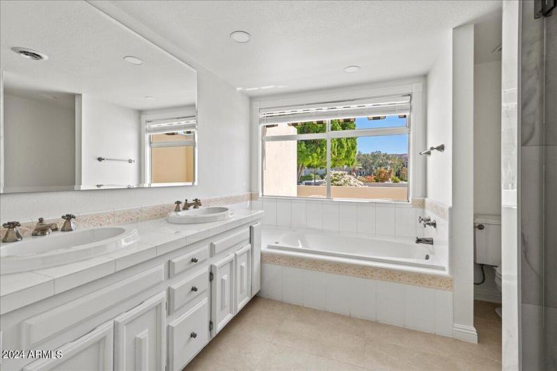 Master bathroom with large mirror