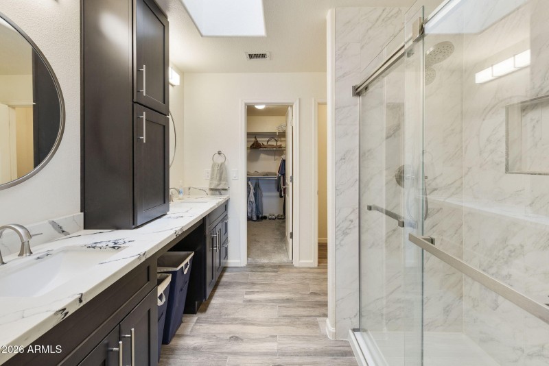 Primary Suite Bathroom and closet entry