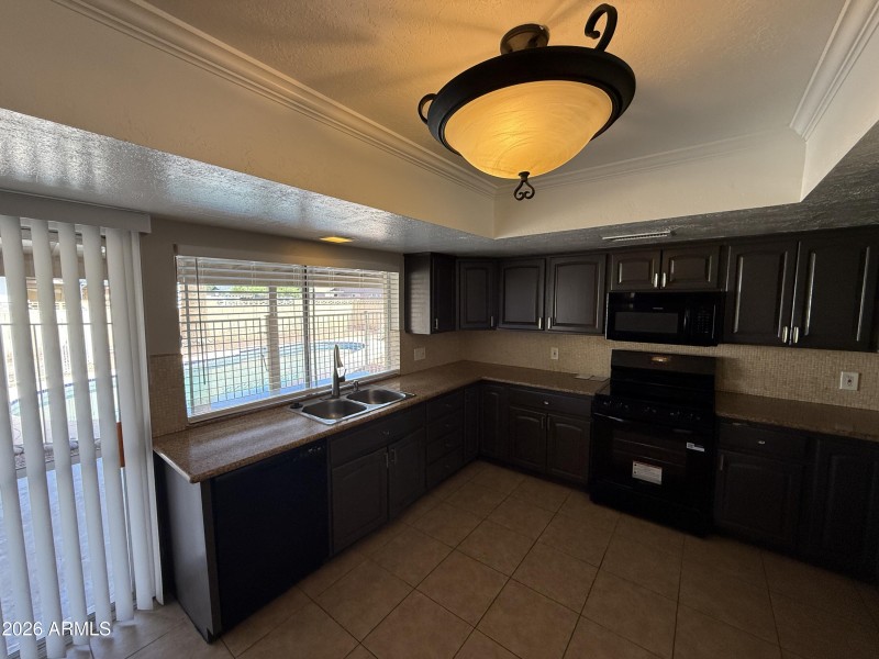Kitchen Overlooking Backyard Pool