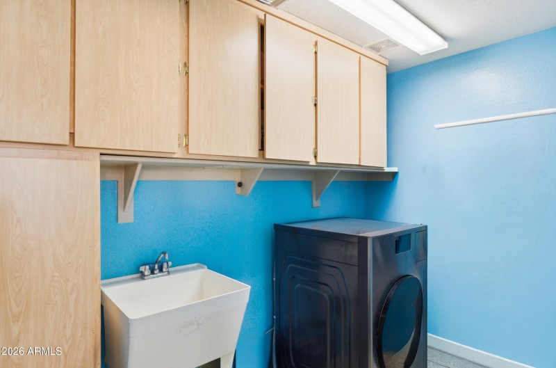 Laundry room with sink