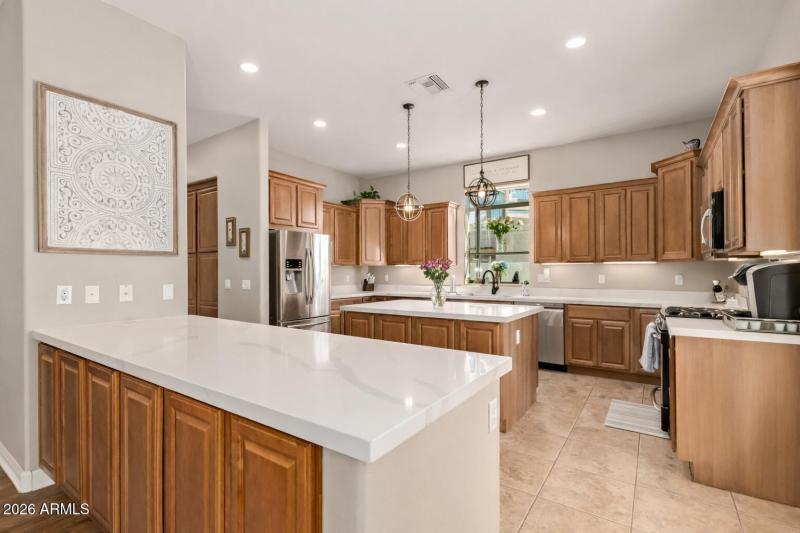 Modern kitchen with white quartz island