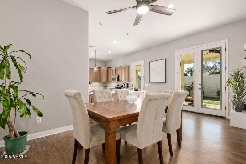 Modern dining space with backyard view