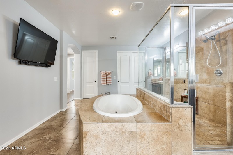 Soaking Tub with a View to Balcony