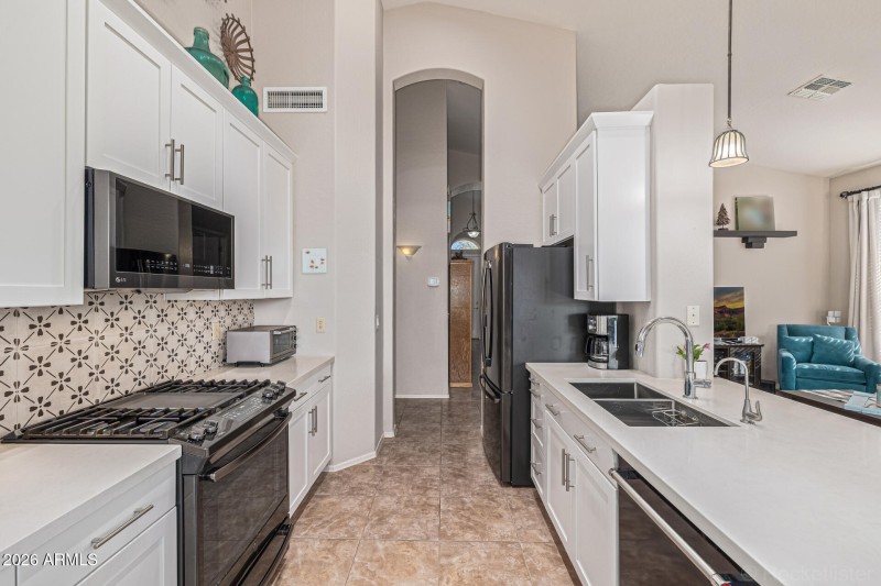 Quartz Countertops and Ample Cabinetry