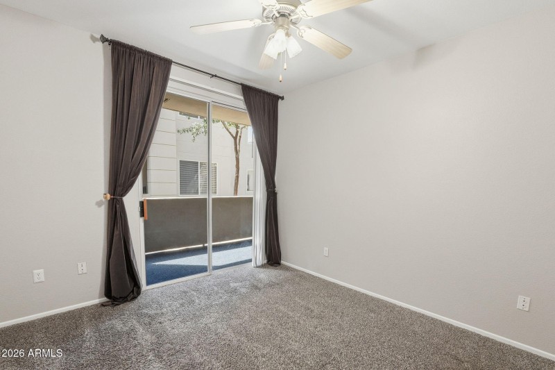 Bedroom with patio sliding door