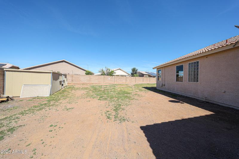 RV side of the yard with storage