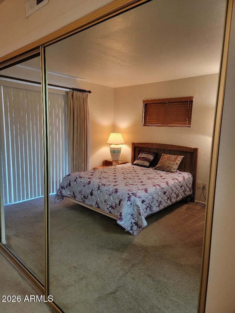 877 large closet with glasss mirrors