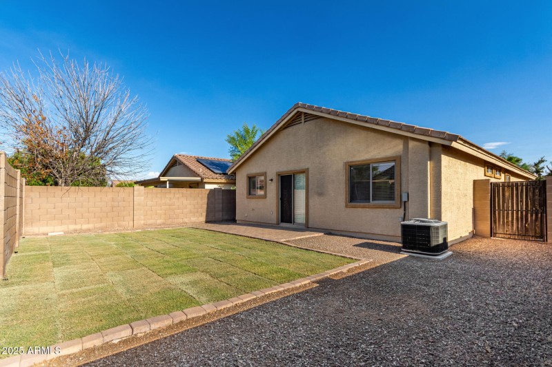 Wide Backyard with Paver Path