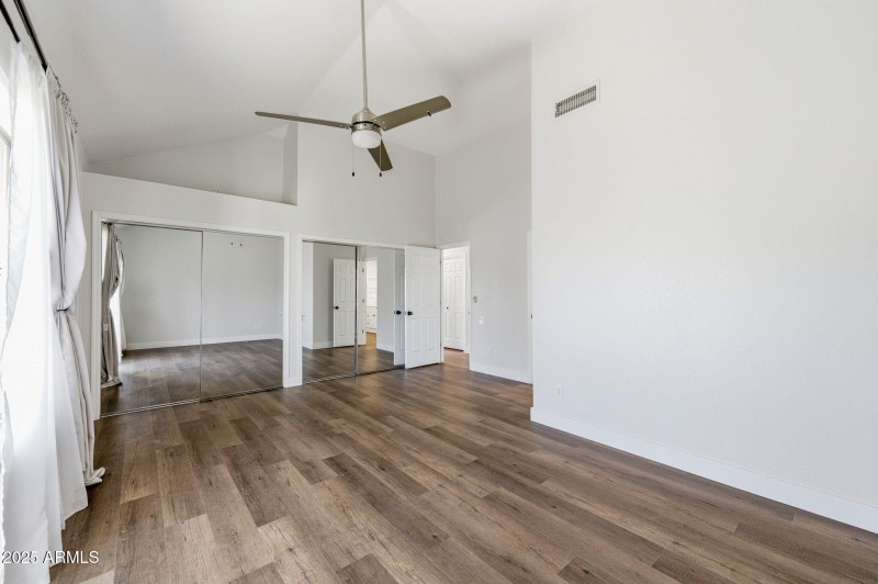 Large primary bedroom with patio