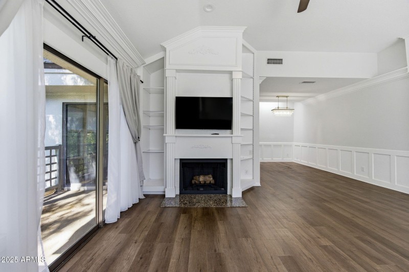 Living room with fireplace and patio