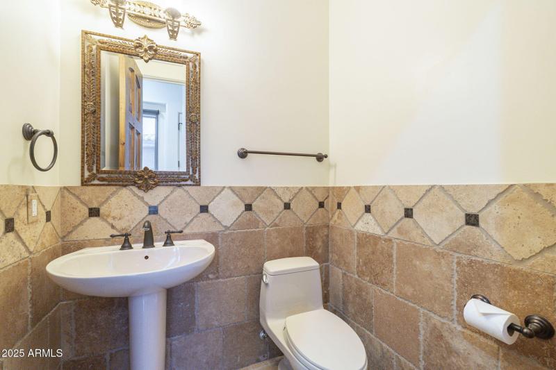 Hall half bath on guest bedroom side