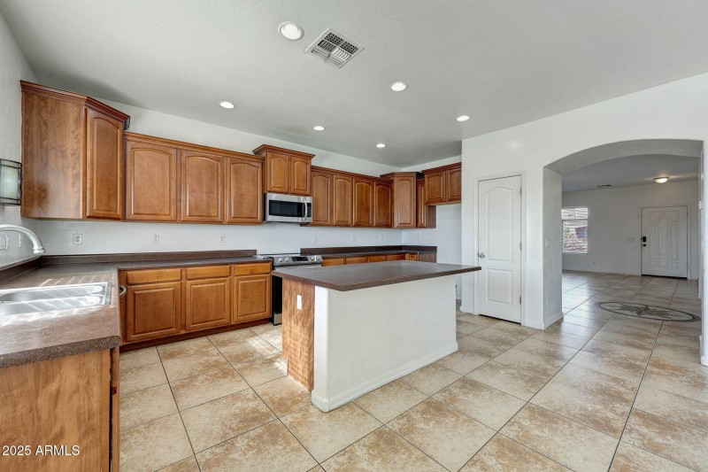 Kitchen with island and breakfast bar
