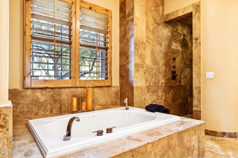 wood shutters at numerous windows