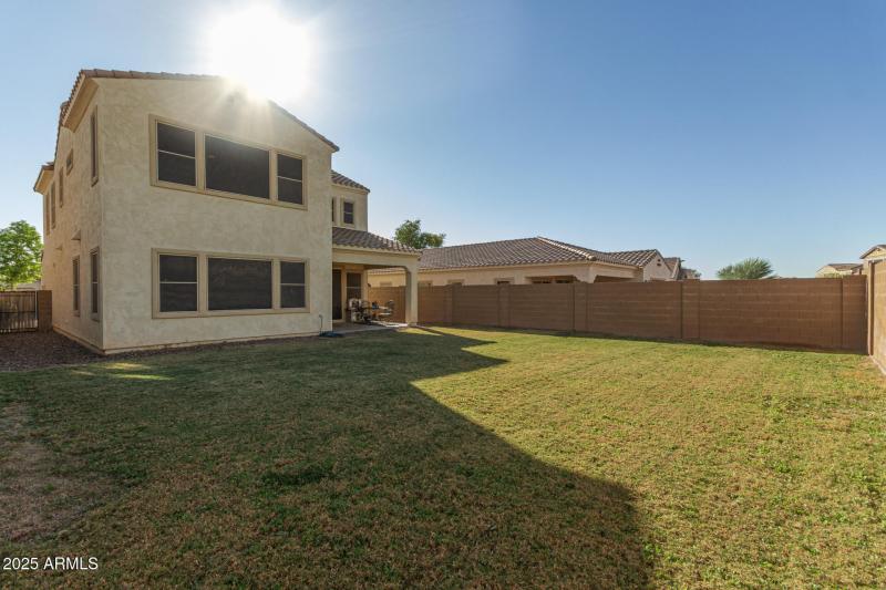 LARGE GREEN BACKYARD WITH COVERED PATIO