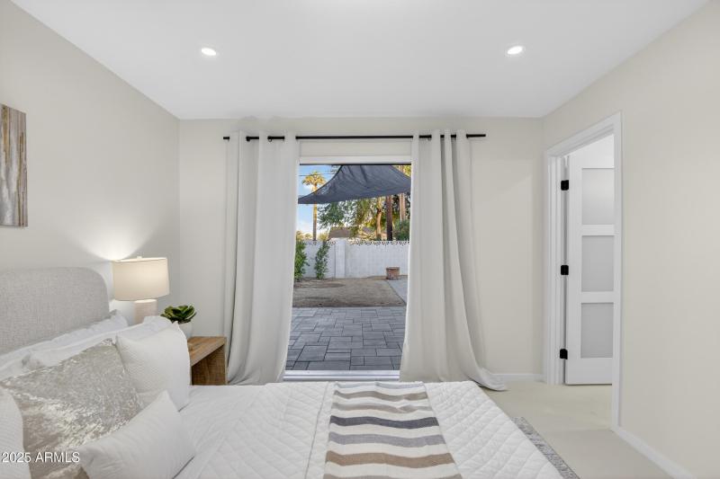 PRIMARY BEDROOM WITH ACCESS TO OUTSIDE