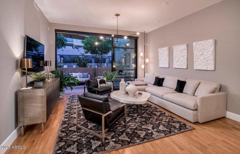 WALL OF GLASS OPENS COURTYARD