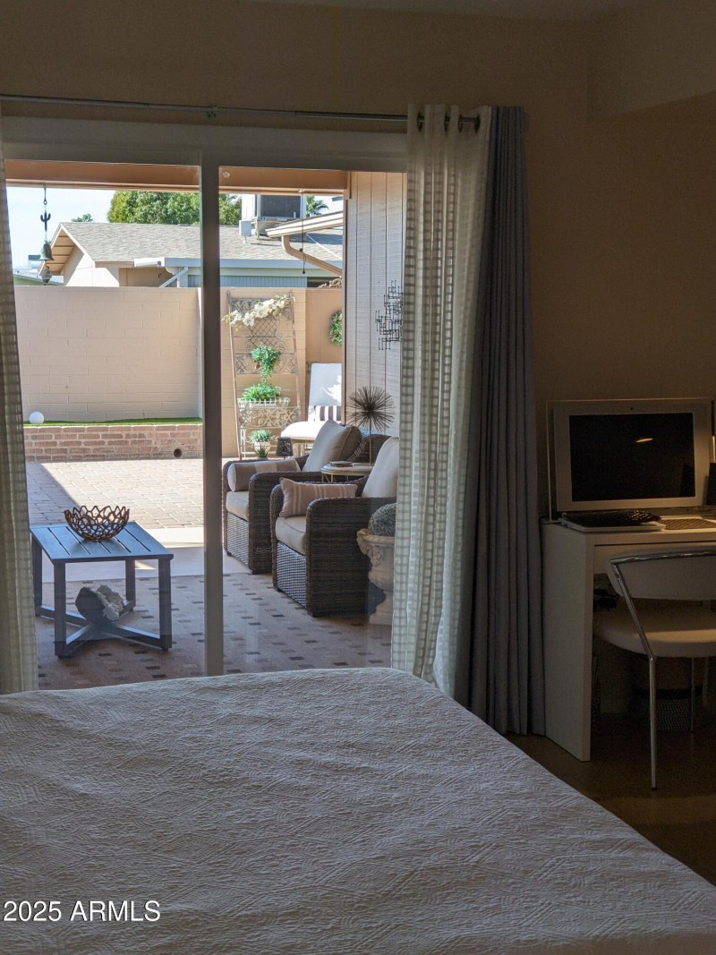 PRIMARY BEDROOM OUT TO COVERED PATIO AND