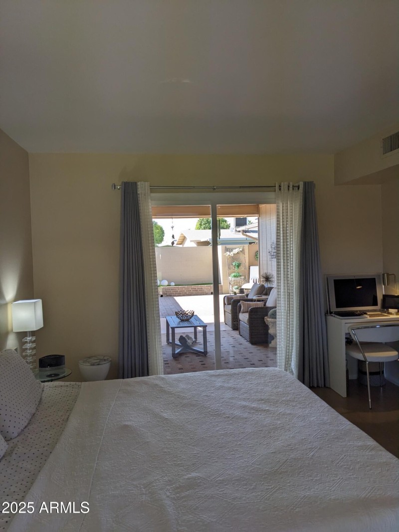 PRIMARY BEDROOM OUT TO THE PATIO