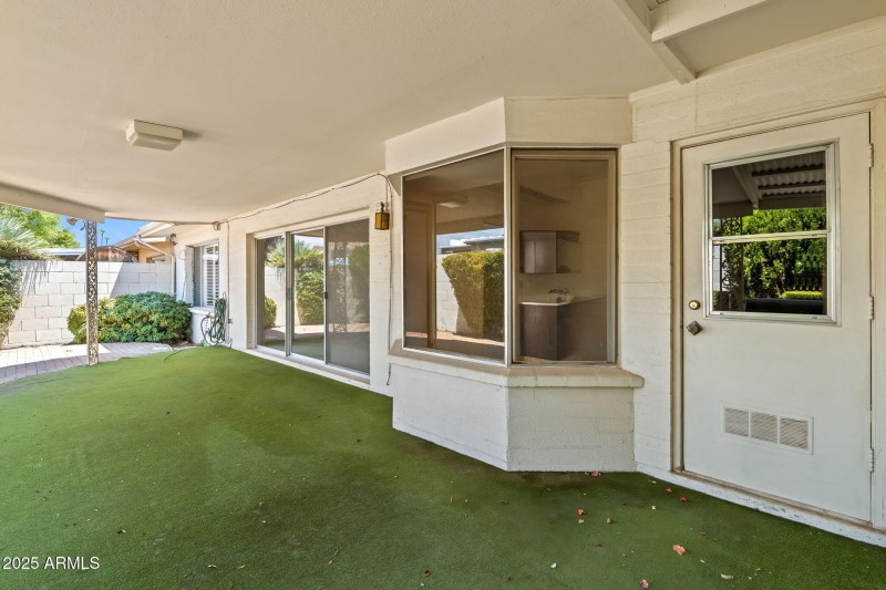 COVERED PATIO (DOOR TO UTILITY ROOM)