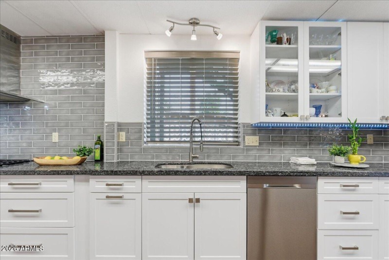Sleek backsplash and granite counters