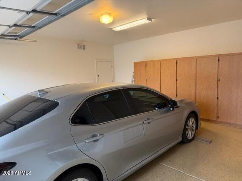 Garage with cabinet/side door