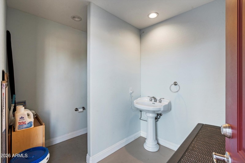 Poolside Bathroom with Sink and Toilet