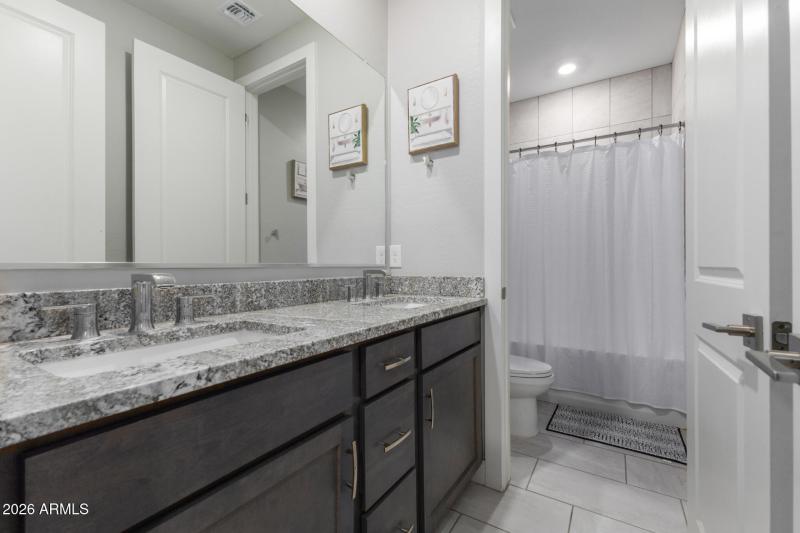 Guest bathroom with granite vanity