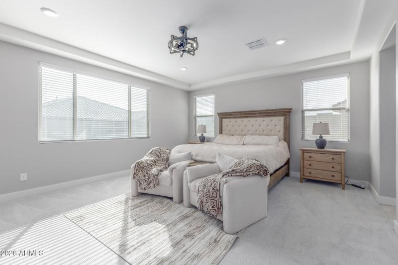 Primary bedroom with seating area