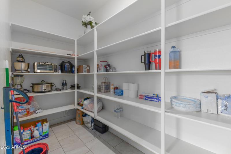 Walk-in pantry with built-in shelving