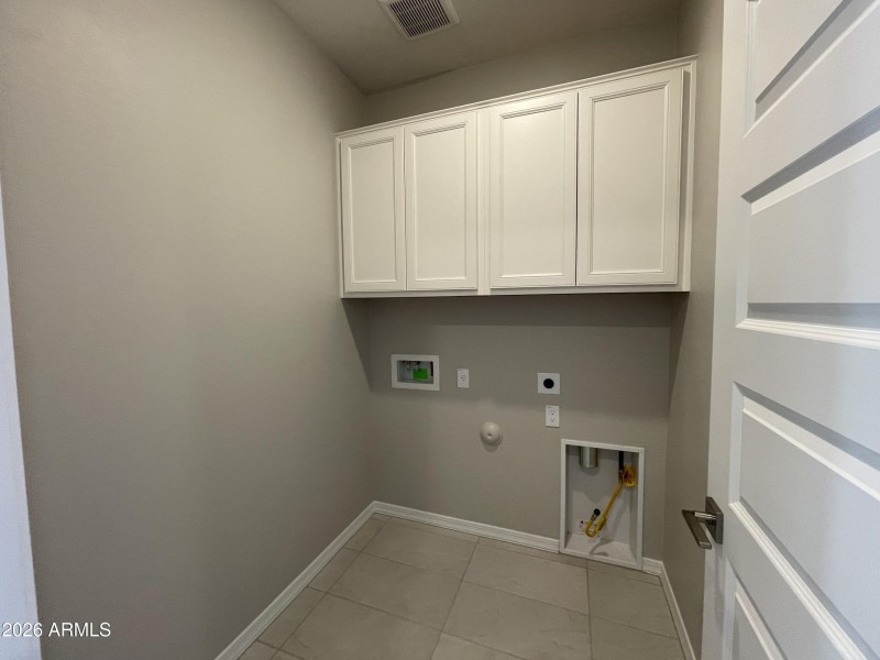 Laundry with cabinets