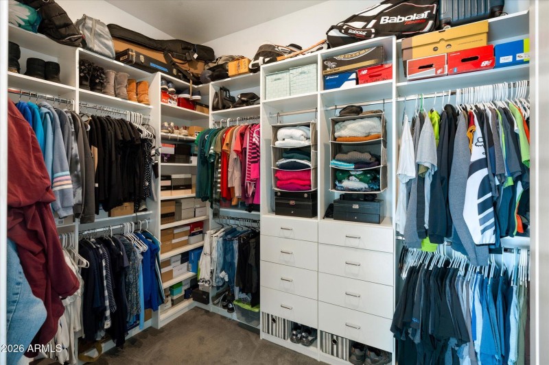 Primary closet w/ built in shelving