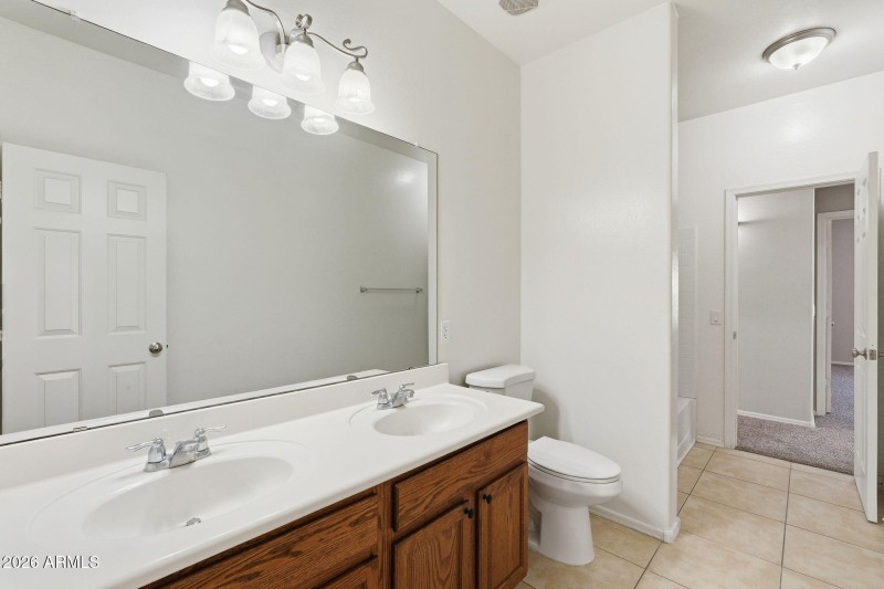 Shared bathroom with dual access