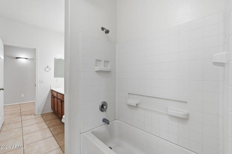 Shared bathroom with dual access