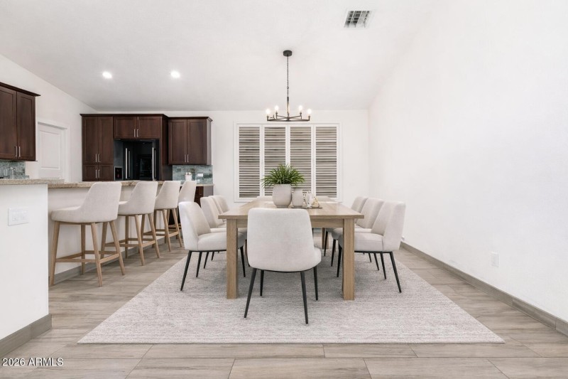 Modern dining area with kitchen view