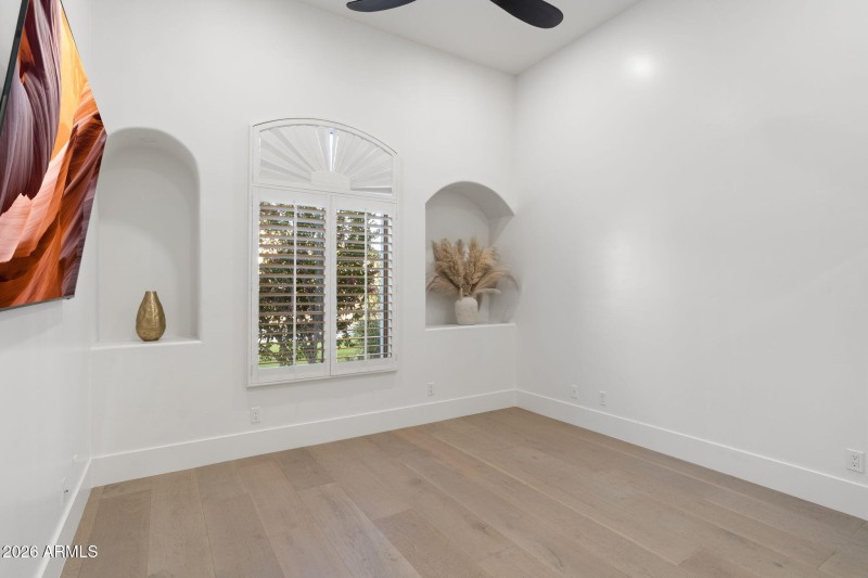 Spacious Bedroom with Wood Floors