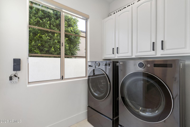 Bright Laundry with Cabinetry