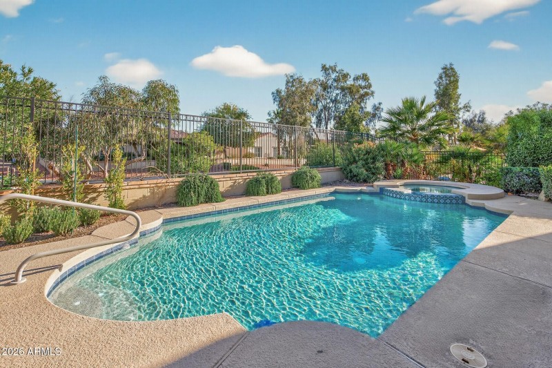 Full sized pool and spa with spillway