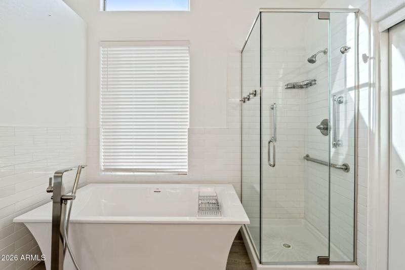Bath tub and shower at Primary Bathroom