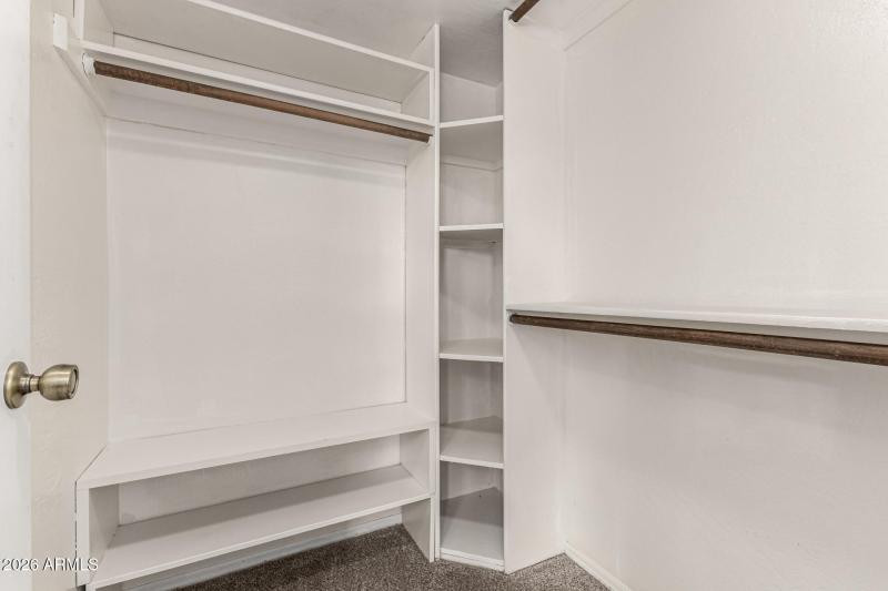 Primary Bedroom walk in closet