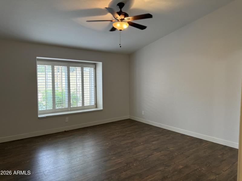 Newly painted master bedroom with seat
