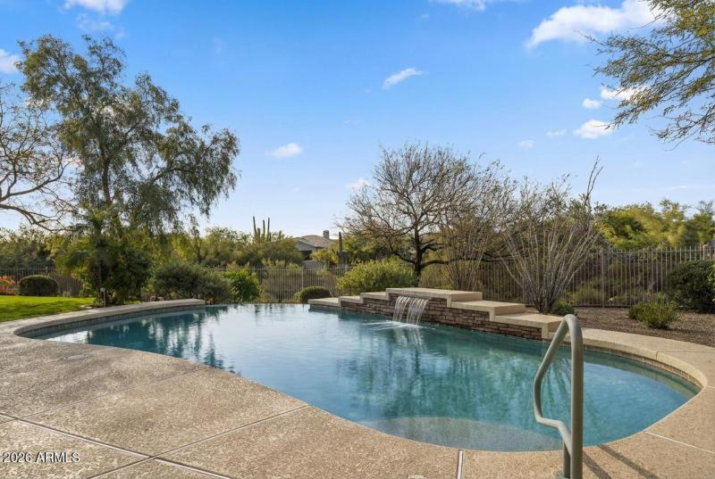 Serene pool with water feature