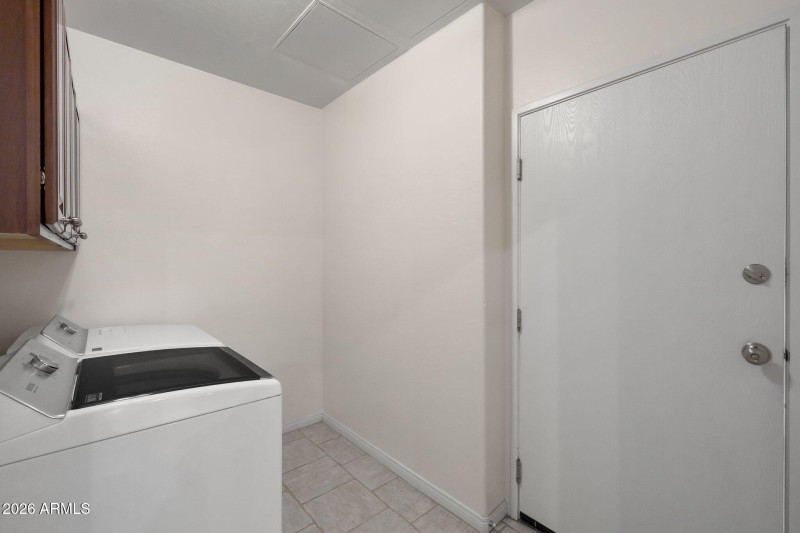 Laundry room includes newer washer & dry