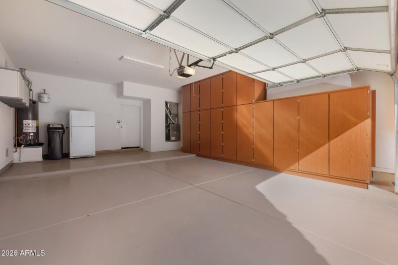 Large 2 car garage with storage cabinets