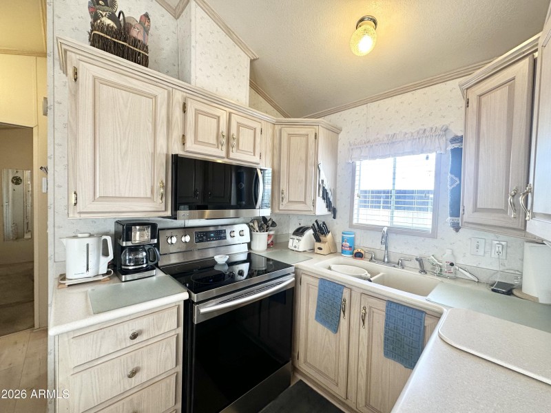 AMPLE LIGHT COLORED CABINETRY