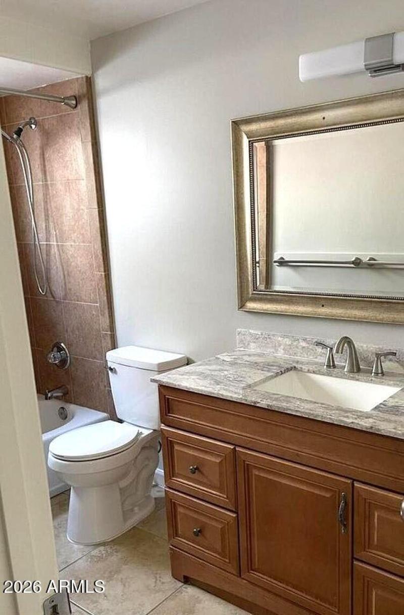 Full bathroom with tub & shower.