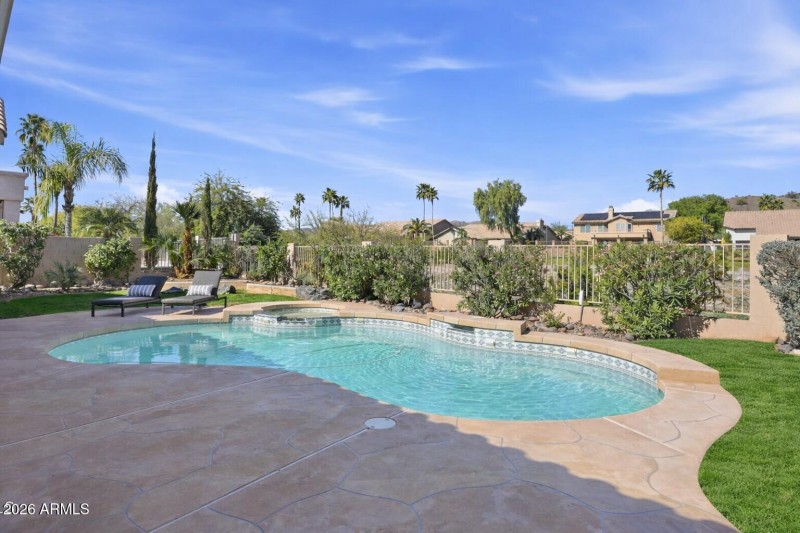Serene backyard with pool and spa