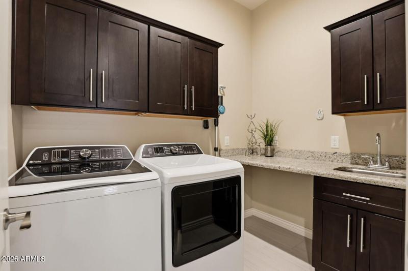 Laundry Room with Sink and Cabinets