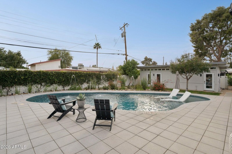 Shellock pavers extend to covered patio